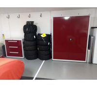 Bespoke range of garage cabinets manufactured to 350mm depth with sliding doors to allow space for cars.  Supplied in new door colour - deep red